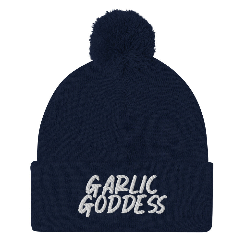 Navy garlic goddess beanie from Nina's Funky Shop by ninanush - GARLIC GODDESS ⚡ This unique garlic goddess hat is warm, cozy, designed by Nina and made just for you. It's a comfortable unisex garlic beanie with a pom pom on top, expertly embroidered with the words "garlic goddess". The perfect weird beanie for garlic lovers and funny garlic hat for garlic enthusiasts of all kinds.