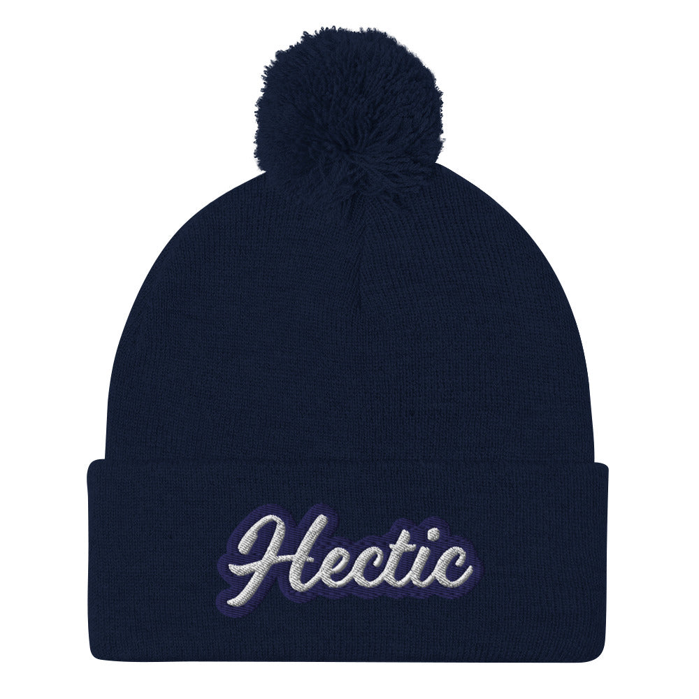 Navy Hectic Beanie from Nina's Funky Shop by ninanush - Hectic ⚡ This unique Hectic Hat is warm, cozy, designed by Nina and made just for you. It's a comfortable unisex hectic beanie with a pom pom on top, expertly embroidered with the word "hectic". The perfect funny accessory for everyday streetwear or gift for that hectic friend.