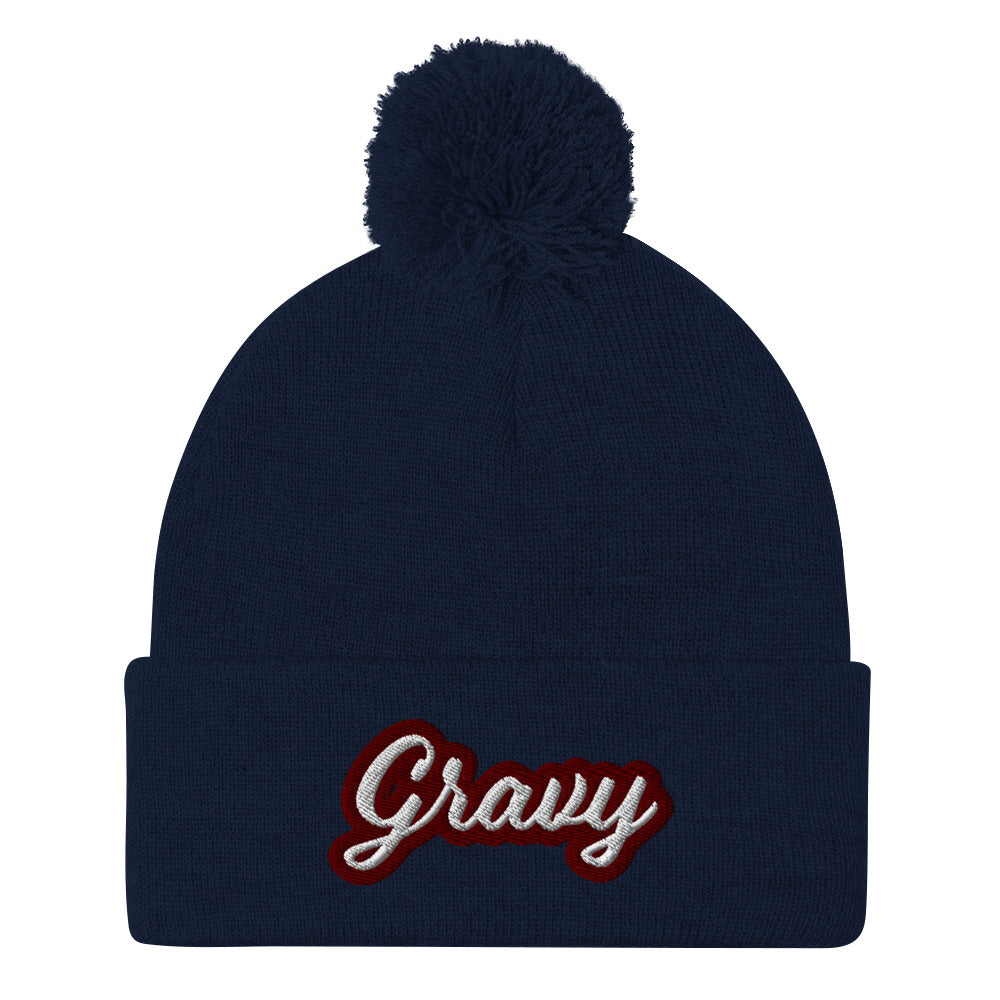 Navy Gravy PomPom Beanie from Nina's Funky Shop by Ninanush - Do you love gravy? Looking for a fun foodie gift? This warm and cozy, embroidered pom pom beanie is just what you need. Eat gravy and celebrate your favorite foods in style with this funny foodie Beanie with "Gravy", expertly embroidered on the front. Perfect for gravy lovers and foodies of all kinds.