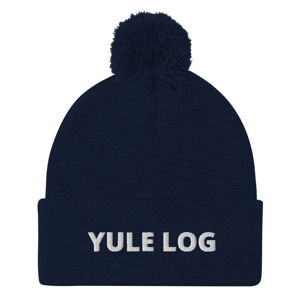 Navy Yule Log Beanie from Nina's Funky Shop by ninanush - Do you love yule logs? Looking for a funny holiday hat? This warm and cozy, embroidered pom pom beanie is just what you need. Celebrate your favorite foods in style with this funny foodie Beanie with "Yule Log", expertly embroidered on the front. The perfect funny holiday gift or Christmas beanie for yule log lovers.