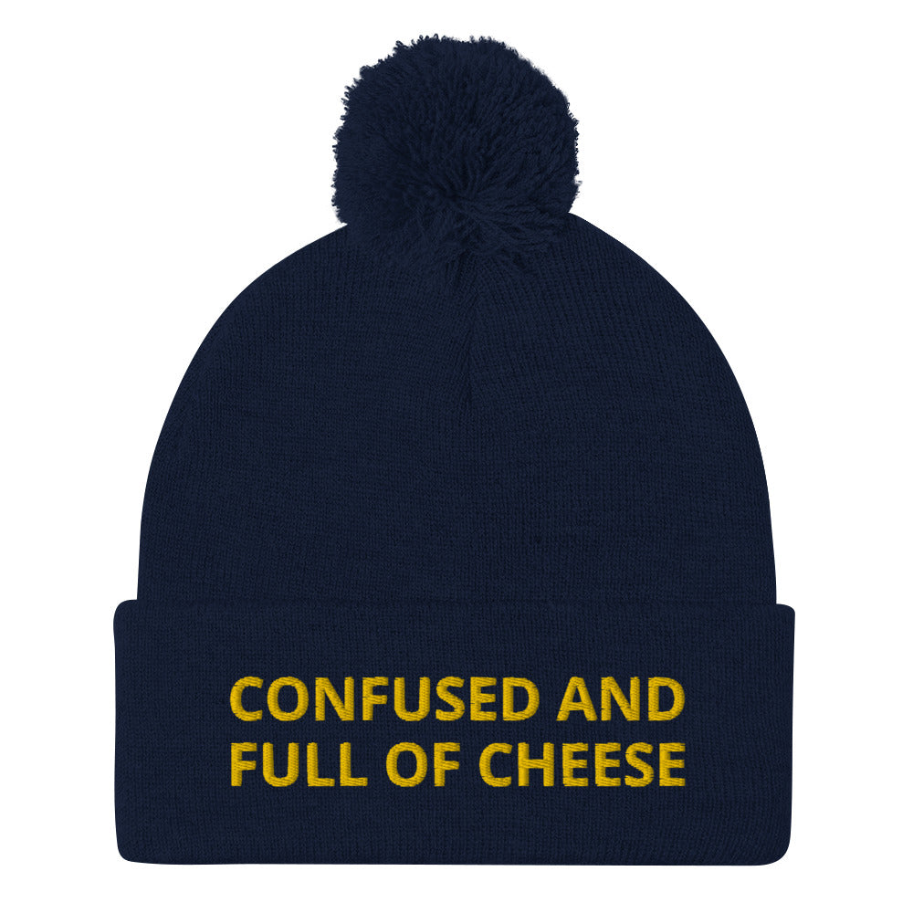 Navy beanie with confused and full of cheese embroidered on the front - Do you love cheese? Looking for a funny gift for a foodie? This warm and cozy, embroidered beanie is just what you need. It's a classic pom pom beanie with "Confused and full of cheese", expertly embroidered on the front. The perfect funny beanie for cheese lovers and foodies of all kinds.