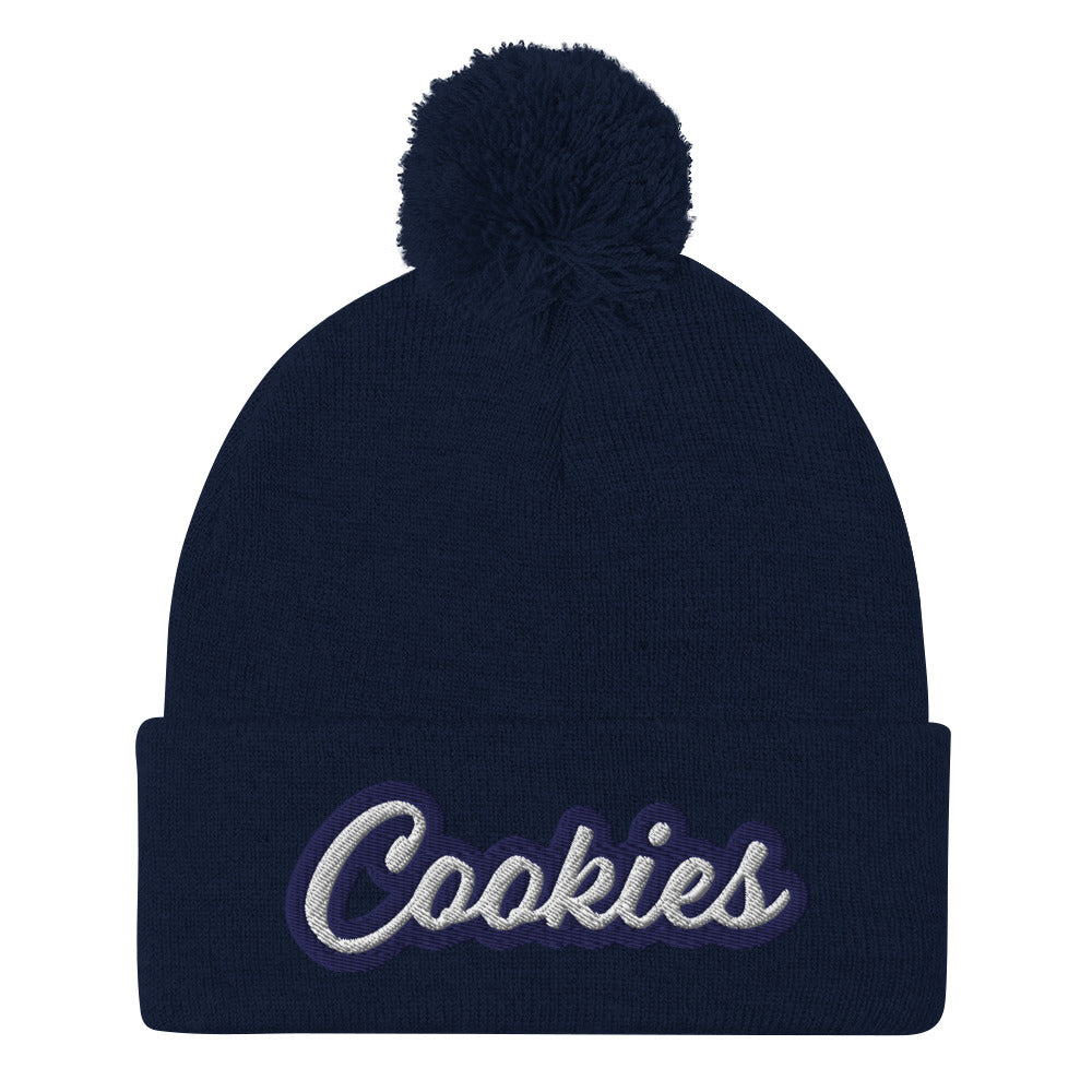 Navy Cookie Hat - Love Cookies? Looking for a gift for a foodie? This cookies hat is just for you! It's a warm and cozy beanie with a classic pom pom on top and "Cookies", expertly embroidered on the front. Designed by Nina and made just for you! Looking for something personalized? A different embroidery color? Shoot us an email or check out our customizable apparel!