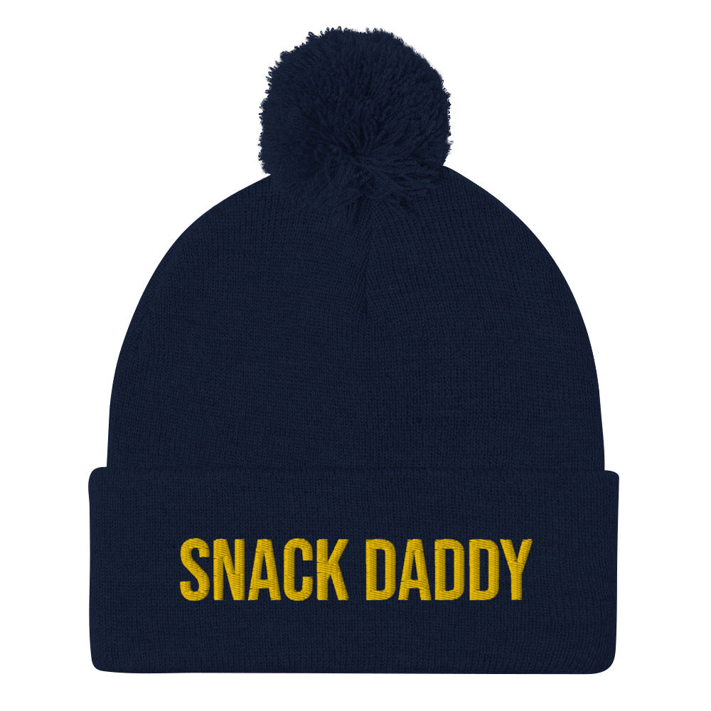 Navy snack daddy beanie - Our Snack Daddy Beanie is comfortable, cozy and made just for you. It's a funny beanie with a pom pom on top, perfect for everyday streetwear or a gift for your favorite snack enthusiast.