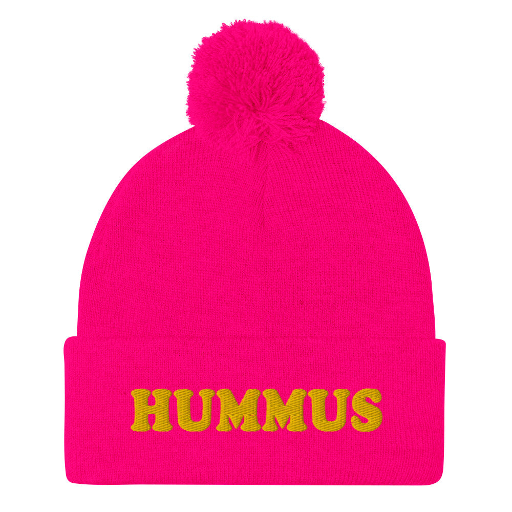 Hot Pink Beanie with Hummus Embroidered on the front in yellow - Do you love hummus? Looking for a funny gift for a foodie? This warm and cozy, embroidered beanie is just what you need. It's a classic pom pom beanie with "HUMMUS", embroidered on the front. The perfect funny beanie for hummus lovers and foodies of all kinds. Celebrate your favorite foods in our funky foodie apparel.