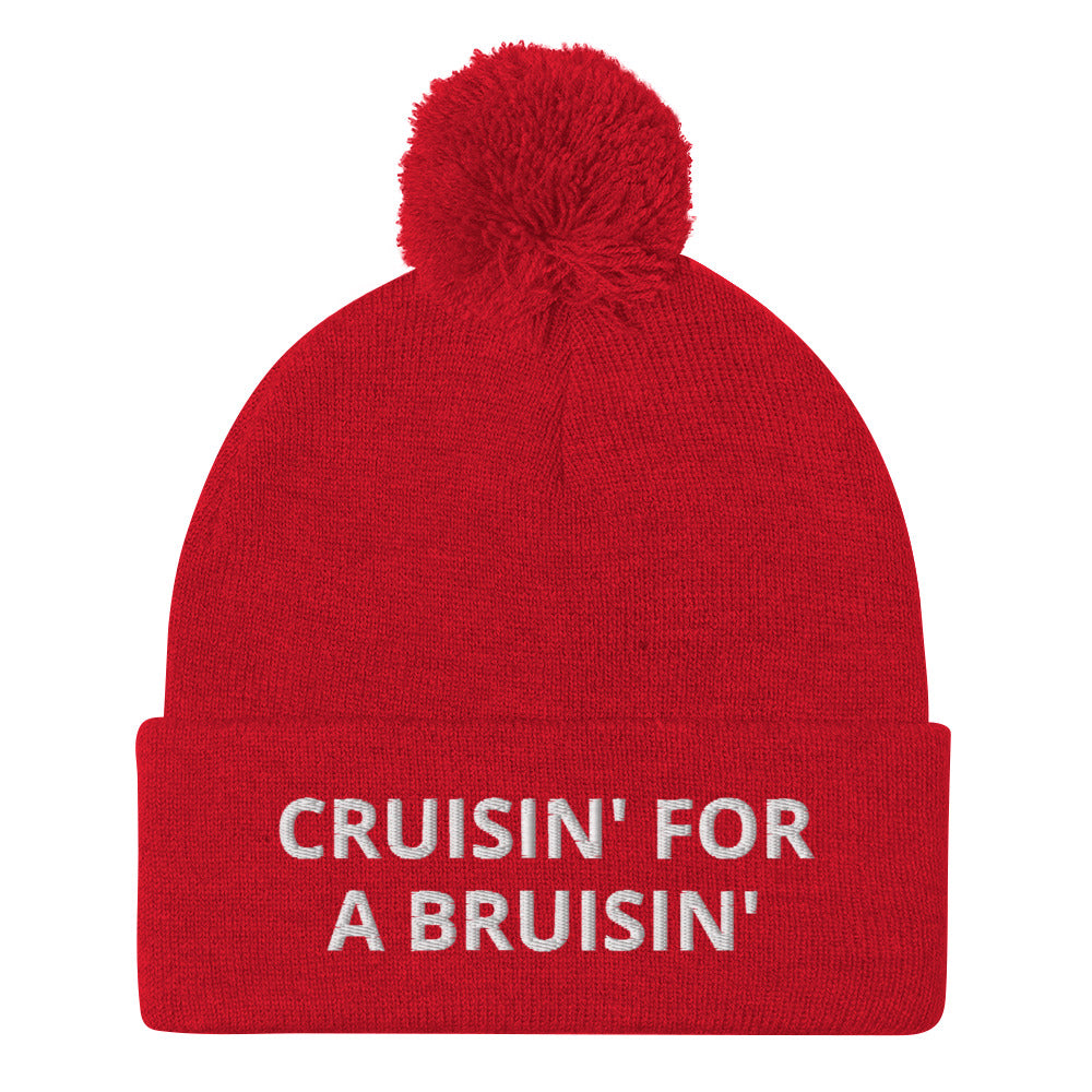 Red Cruisin' for a Bruisin' Hat from Nina's Funky Shop by ninanush - This Cruisin' For A Buisin' Hat is warm, cozy, designed by Nina and made just for you. It's a comfortable unisex garlic beanie with a pom pom on top, expertly embroidered with the words "Cruisin For A Bruisin'". Stand out and stay warm in the perfect weird and funny beanie for all your cold weather looks.