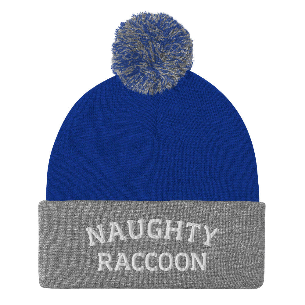 Royal blue and gray naughty raccoon beanie from Nina's Funky Shop by ninanush - This Naughty Raccoon hat is warm, cozy, designed by Nina and made just for you. It's a comfortable unisex beanie with a pom pom on top, expertly embroidered with the words "naughty raccoon". The perfect weird beanie for raccoon enthusiasts and funny hat for quirky accessory lovers of all kinds.