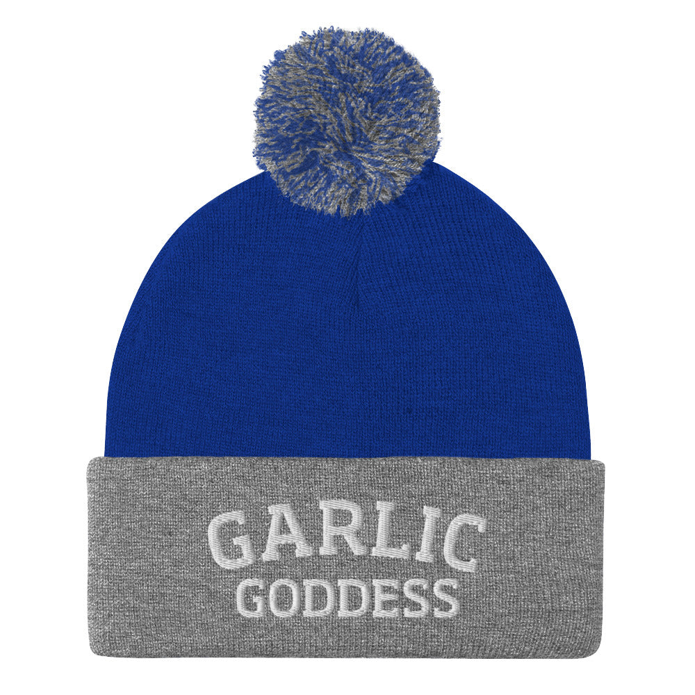 Royal blue and gray garlic goddess beanie from Nina's Funky Shop by ninanush - GARLIC GODDESS ⚡ This garlic goddess hat is warm, cozy, designed by Nina and made just for you. It's a comfortable unisex garlic beanie with a pom pom on top, expertly embroidered with the words "garlic goddess". The perfect weird beanie for garlic lovers and funny garlic hat for garlic enthusiasts of all kinds.