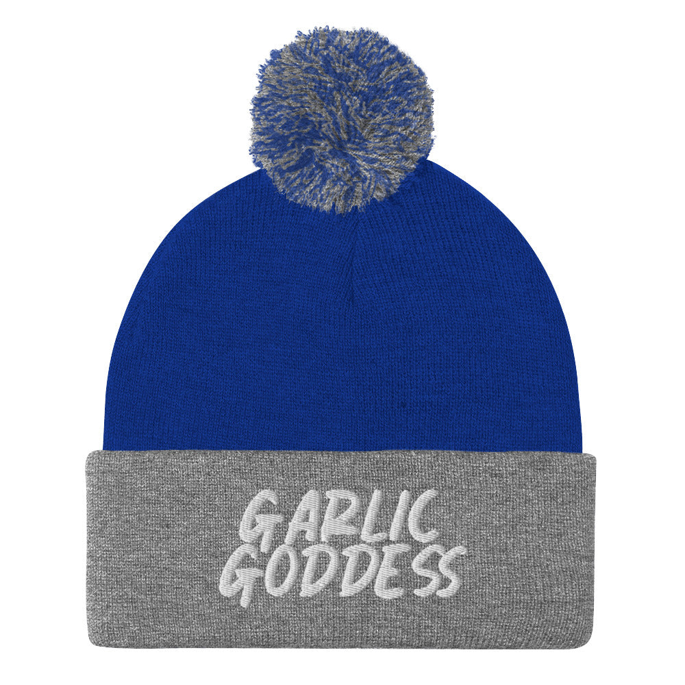 Royal blue and gray garlic goddess beanie from Nina's Funky Shop by ninanush - GARLIC GODDESS ⚡ This unique garlic goddess hat is warm, cozy, designed by Nina and made just for you. It's a comfortable unisex garlic beanie with a pom pom on top, expertly embroidered with the words "garlic goddess". The perfect weird beanie for garlic lovers and funny garlic hat for garlic enthusiasts of all kinds.