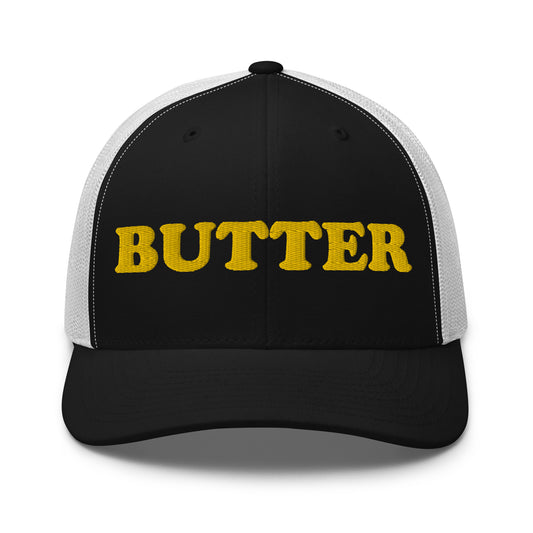 Black and white butter trucker hat - Are you a butter enthusiast? Looking for a funny gift? Our Butter Hat is comfortable and made just for you. It comes in a variety of colors with "butter", expertly embroidered on the front. Make a statement and eat your favorite buttery foods in our butter trucker hat.