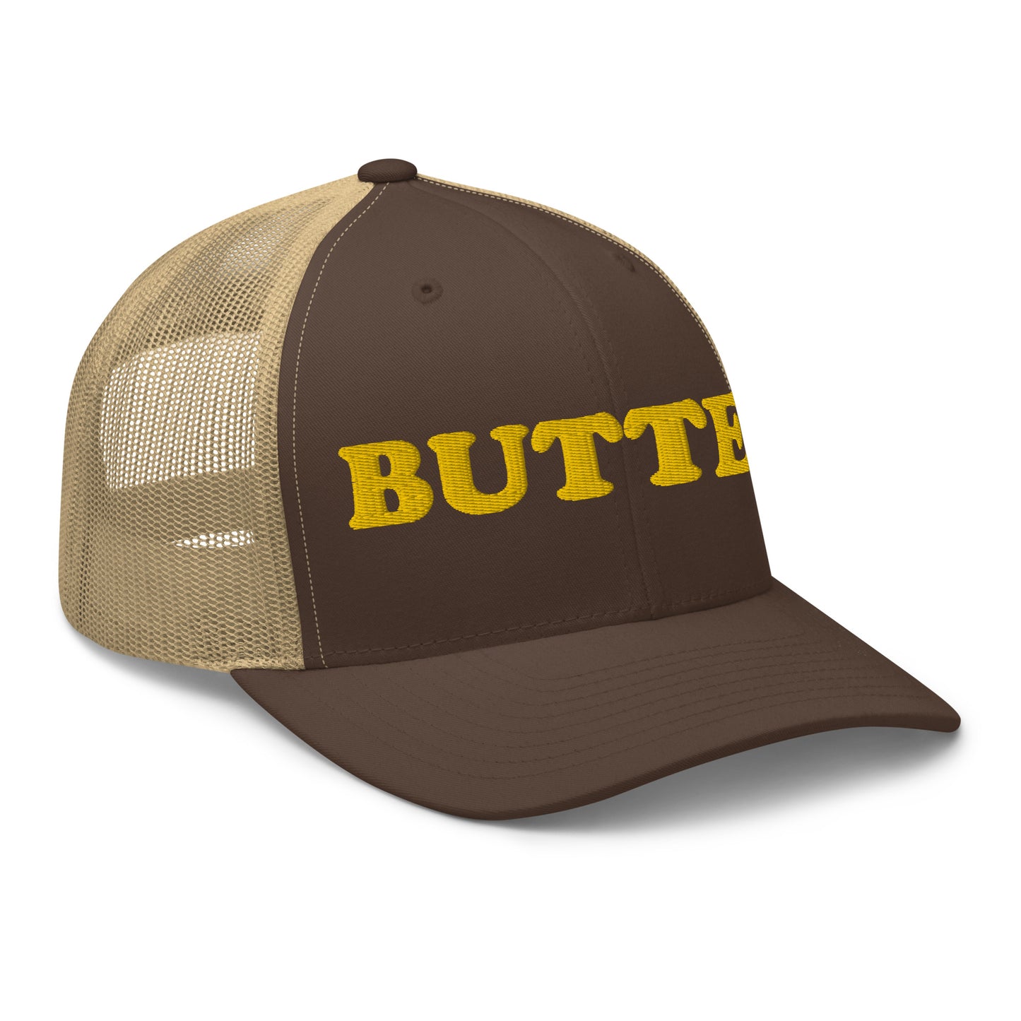 Brown trucker hat with "butter" embroidered on the front in yellow - Are you a butter enthusiast? Looking for a funny gift? Our Butter Hat is comfortable and made just for you. It comes in a variety of colors with "butter", expertly embroidered on the front. Make a statement and eat your favorite buttery foods in our butter trucker hat.