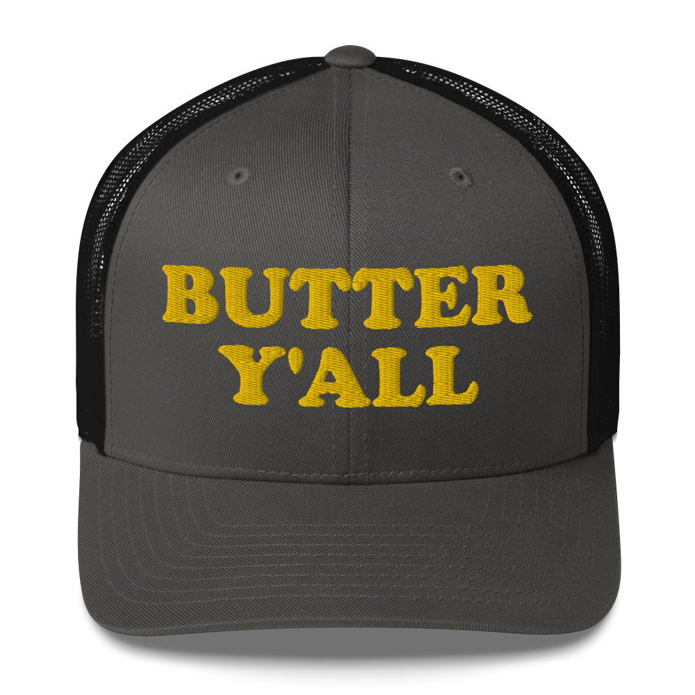 Black and Dark Gray Butter Hat - Are you a butter enthusiast? Looking for a funny gift? Our Butter Y'all Hat is comfortable and made just for you. It comes in a variety of colors with a funny butter phrase, expertly embroidered on the front. Make a statement and eat your favorite buttery foods in our butter y'all trucker hat.  Edit alt text