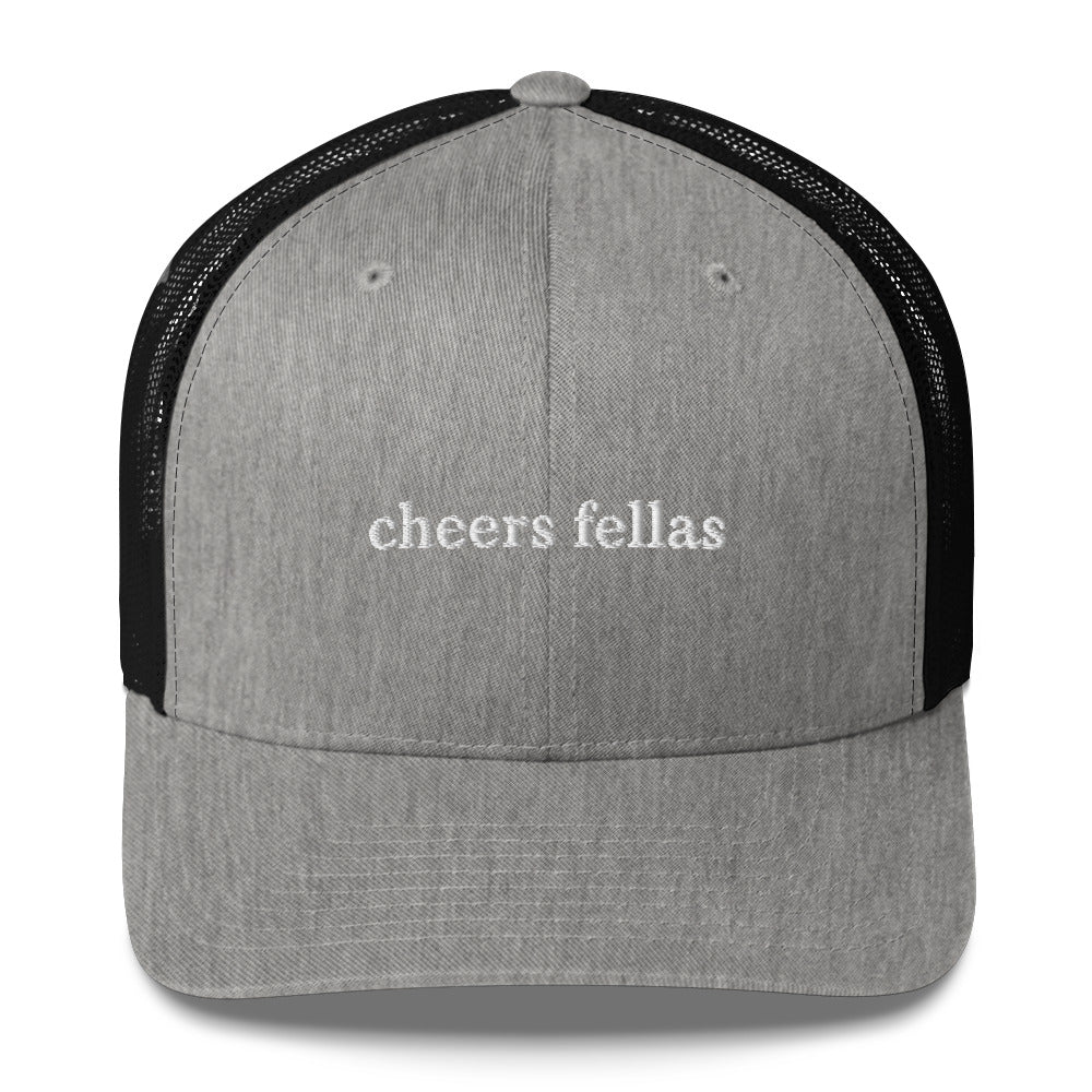 Cheers Fellas Gray and Black Trucker Hat from Nina's Funky Shop by ninanush - Let your hat do the talking. This Cheers Fellas Hat is comfortable, comes in a variety of colors and has a convenient adjustable closure. Wear our cheers fellas trucker hat as everyday streetwear or give it as a fun gift for the fellas. It's a classic trucker hat with a funny saying, expertly embroidered on the front.