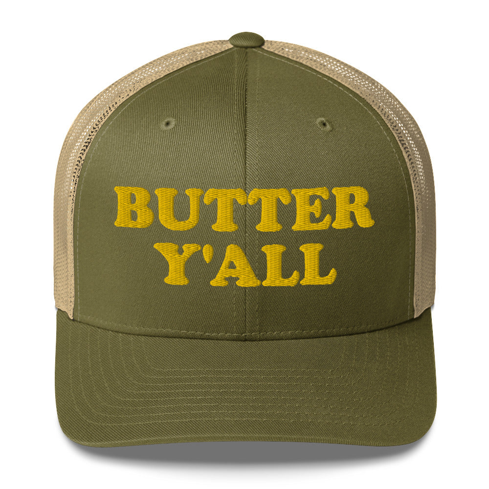 Green and khaki Butter Hat - Are you a butter enthusiast? Looking for a funny gift? Our Butter Y'all Hat is comfortable and made just for you. It comes in a variety of colors with a funny butter phrase, expertly embroidered on the front. Make a statement and eat your favorite buttery foods in our butter y'all trucker hat.  Edit alt text