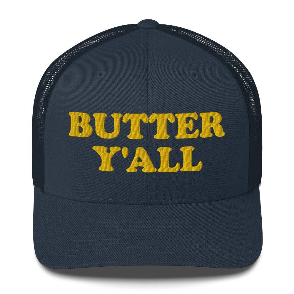 Navy Butter Hat - Are you a butter enthusiast? Looking for a funny gift? Our Butter Y'all Hat is comfortable and made just for you. It comes in a variety of colors with a funny butter phrase, expertly embroidered on the front. Make a statement and eat your favorite buttery foods in our butter y'all trucker hat.  Edit alt text