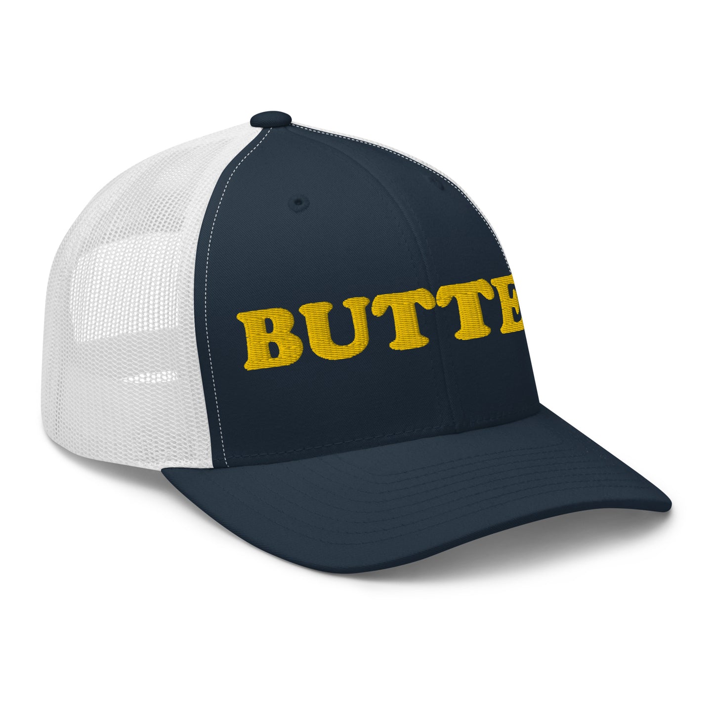 navy and white trucker hat with "butter" embroidered on the front in yellow - Are you a butter enthusiast? Looking for a funny gift? Our Butter Hat is comfortable and made just for you. It comes in a variety of colors with "butter", expertly embroidered on the front. Make a statement and eat your favorite buttery foods in our butter trucker hat.