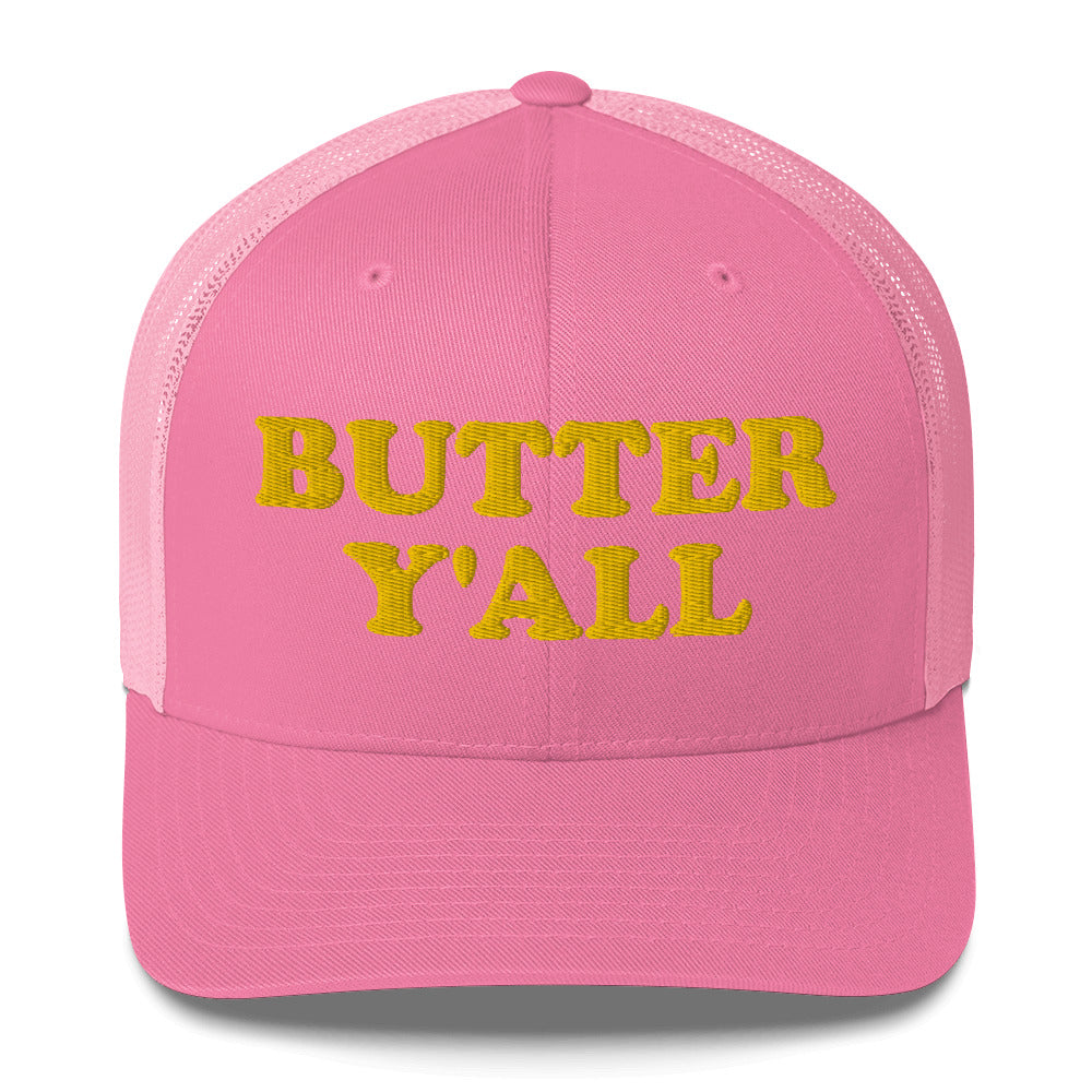 Pink Butter Hat - Are you a butter enthusiast? Looking for a funny gift? Our Butter Y'all Hat is comfortable and made just for you. It comes in a variety of colors with a funny butter phrase, expertly embroidered on the front. Make a statement and eat your favorite buttery foods in our butter y'all trucker hat.  Edit alt text