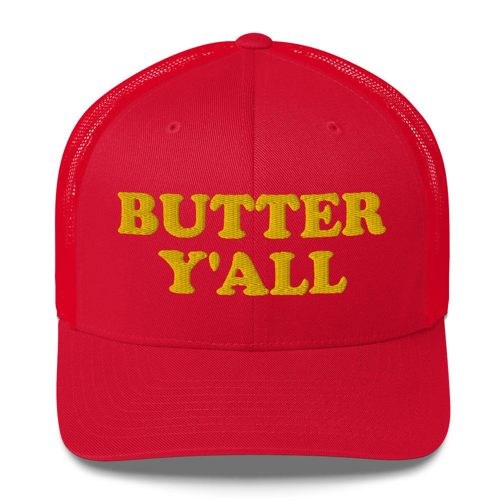 Red Butter Hat - Are you a butter enthusiast? Looking for a funny gift? Our Butter Y'all Hat is comfortable and made just for you. It comes in a variety of colors with a funny butter phrase, expertly embroidered on the front. Make a statement and eat your favorite buttery foods in our butter y'all trucker hat.  Edit alt text