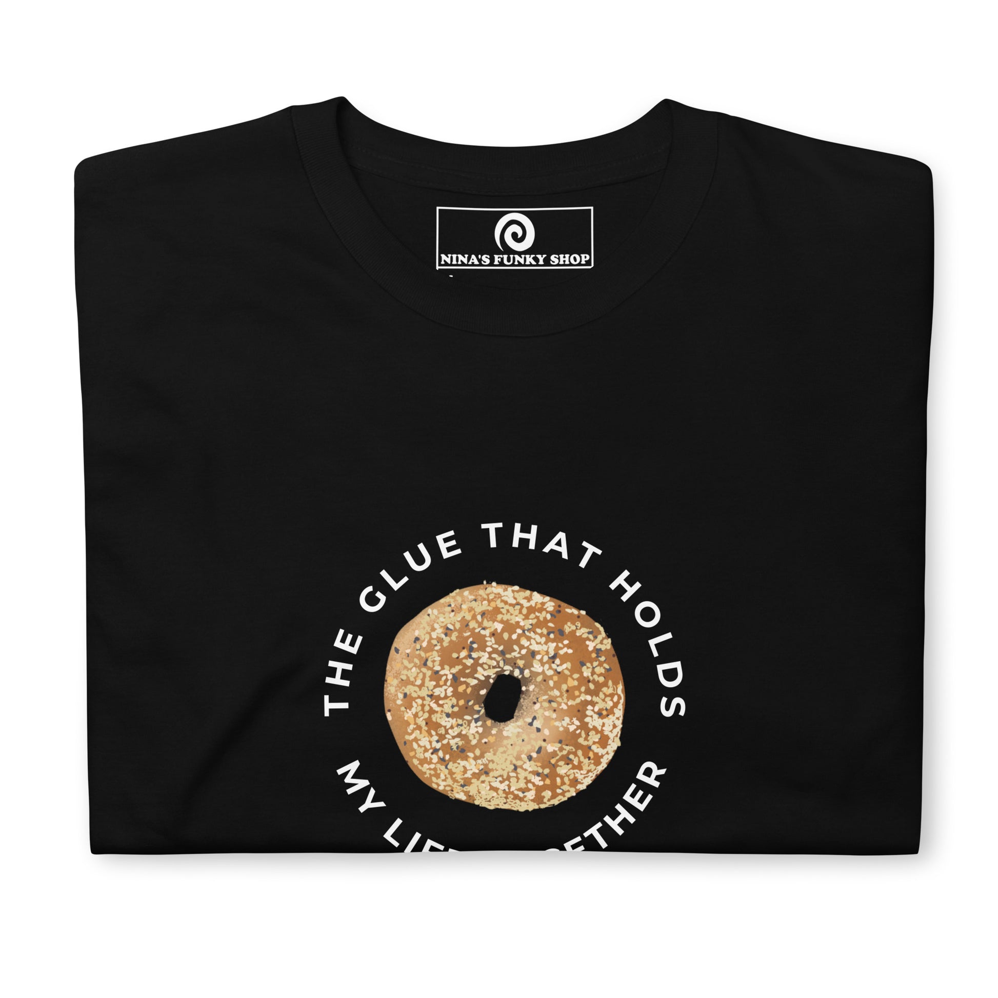 Black Everything Bagel T-Shirt - Our Bagels Are The Glue That Holds My Life Together T-Shirt is soft, comfortable and just what you need! It's a classic cotton tee with a funny everything bagel design, expertly printed on the front. The perfect shirt for bagel lovers and foodies of all kinds. Unique foodie apparel designed by Nina and made just for you.