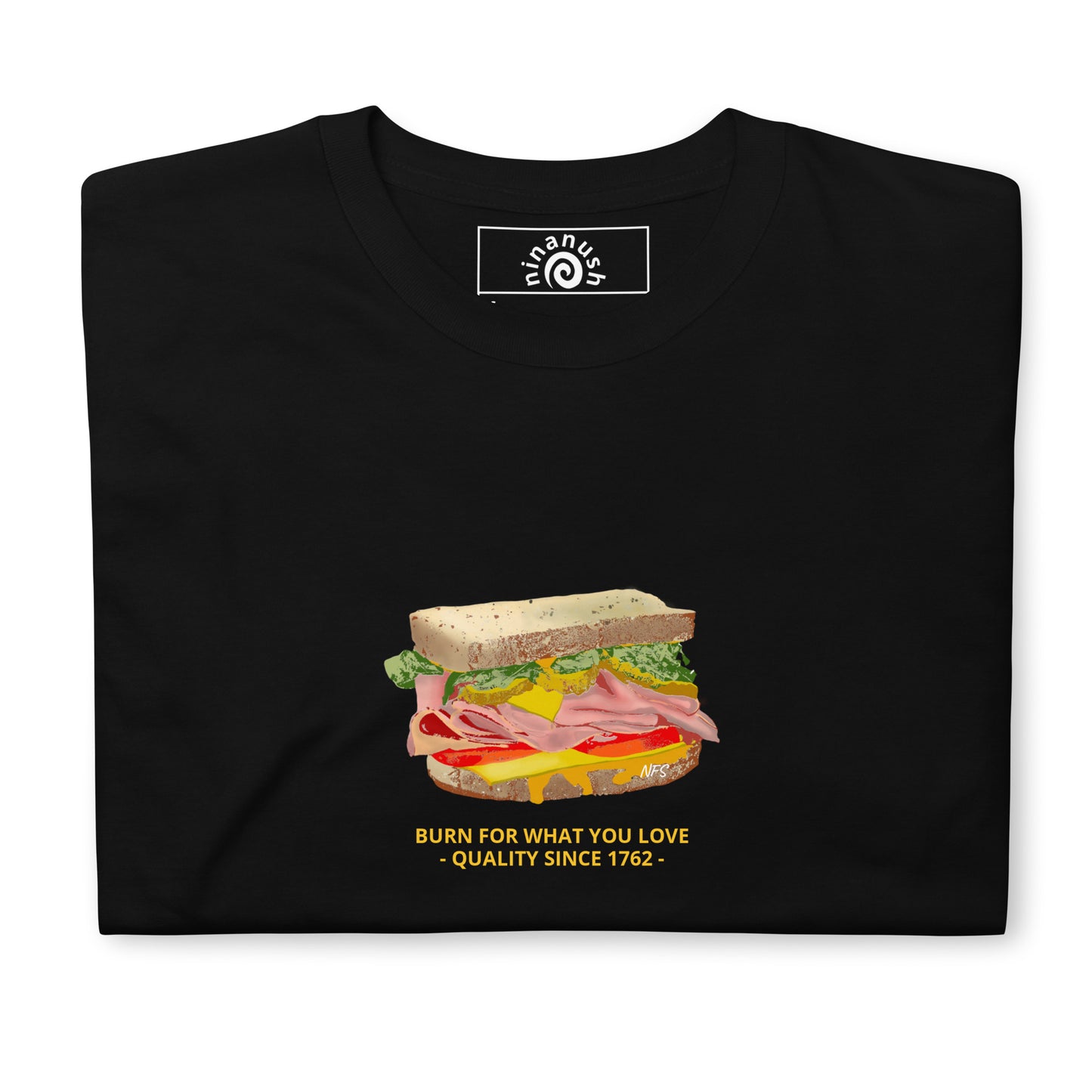 Black Sandwich T-Shirt -Do you love Sandwiches? Looking for a funny gift for a friend? Our colorful Sandwich T-shirt is just what you need. It's a soft and comfortable sandwich lover shirt with an original funky design by Nina, expertly printed on the front. It features a loaded sandwich with the words "Sandwich" and "Burn for what you love - quality since 1762 -" in yellow.