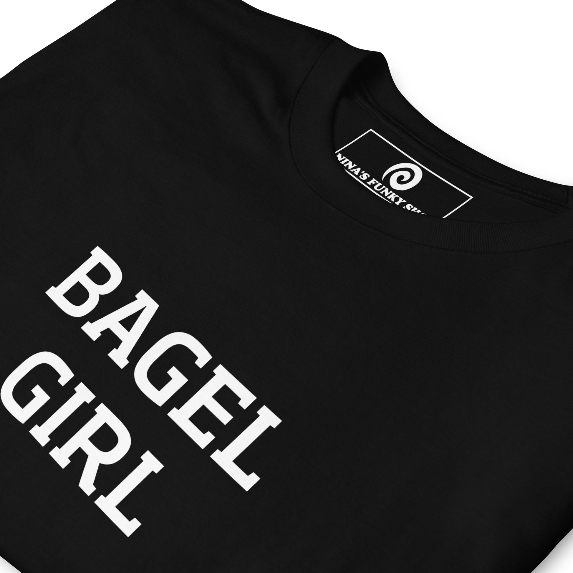 Black Bagel Girl T-shirt -Love bagels? Looking for a funny gift for a bagel girl? This bold bagel t-shirt is just what you need. It's soft and comfortable with a funny bagel design, expertly printed on the front. The perfect shirt for bagel lovers and foodies of all kinds. Designed by Nina and made just for you.