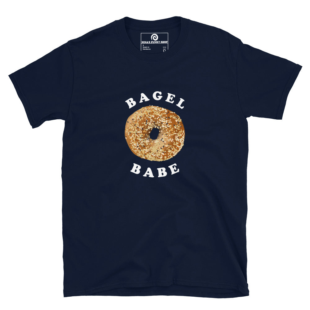 Navy bagel babe t-shirt - Love bagels? Looking for a gift for a bagel enthusiast? This t-shirt is soft, comfortable and comes in a variety of colors with an everything bagel design, expertly printed on the front. Eat your favorite bagels in style or give this funny food t-shirt as a gift for a bagel lover. The perfect graphic tee for foodies and beyond.