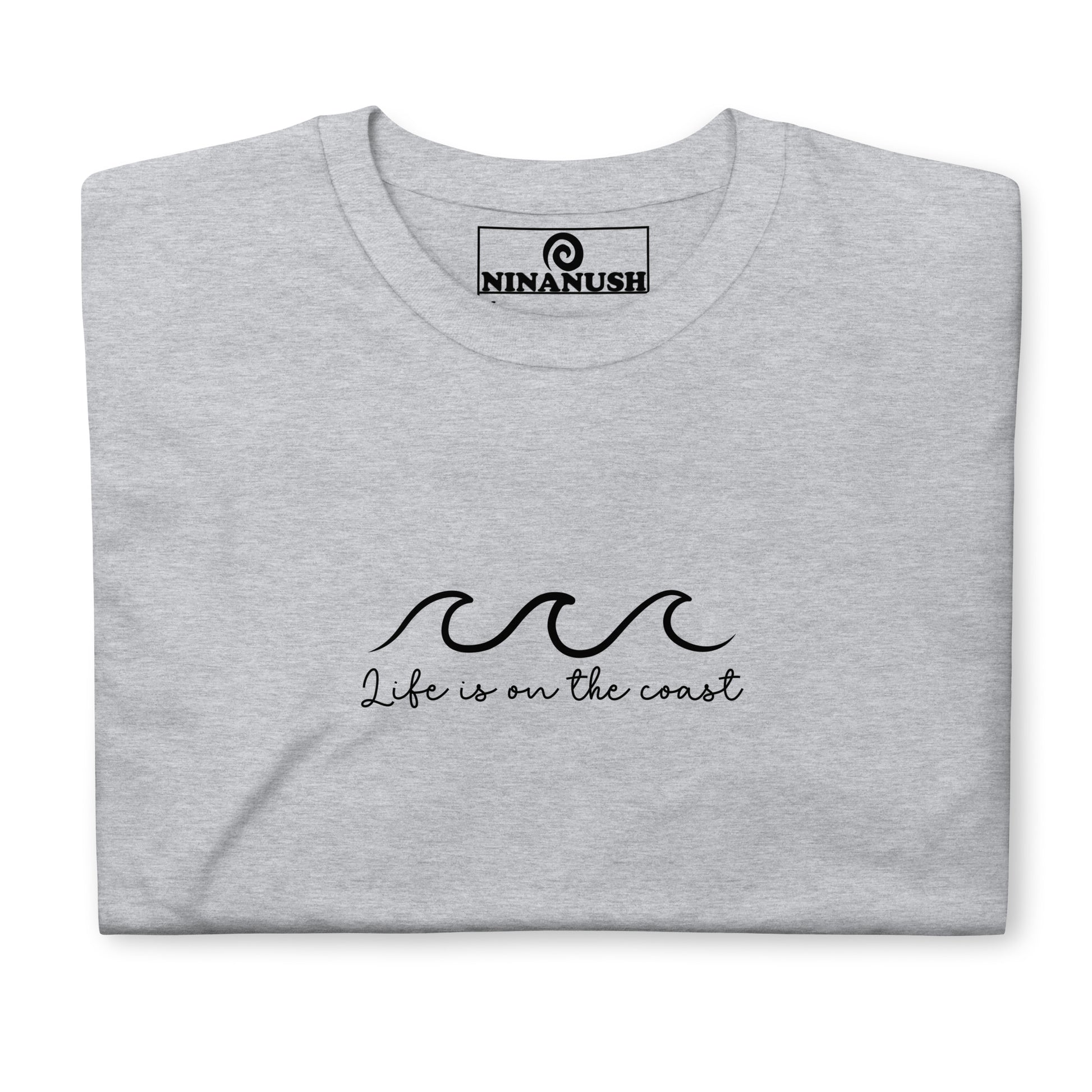 Gray coastal life shirt - "Life is on the coast" A cotton T-Shirt with a simple coastal quote and wave on the front. This coast life shirt is designed for ocean lovers and made just for you and your favorite beach enthusiast. Celebrate the seacoast in this unique tee, give it as a gift for seacoast lovers or shop our New England foodie apparel.