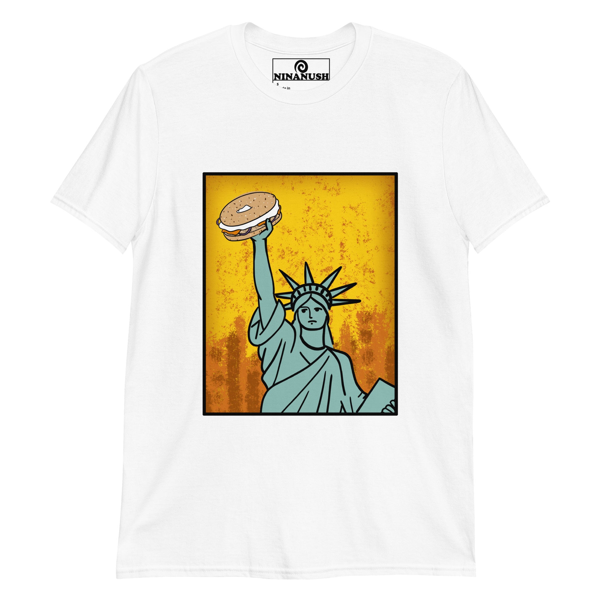 White bagel shirt - Funky Statue of Liberty T-shirt. Eat bagels in style in a funny food t-shirt for bagel lovers. It's a colorful graphic tee with a totally unique hand drawn design of the Statue of Liberty holding a bagel. It's just what every bagel enthusiast needs. Make a statement or give it as a funny gift for bagel lovers. 