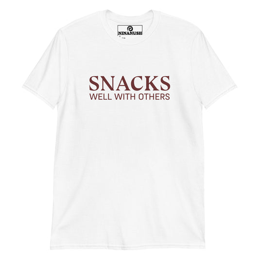 White snack lover t-shirt - Snacks well with others! A classic cotton tee with a funny snack lover saying on the front. This funny food t-shirt is designed for snack enthusiasts and made just for you. Embrace your inner snack monster and let your passion shine with this eye-catching social snacker graphic tee. Eat snacks in our funny snack tee.