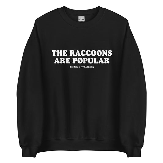 Black The Raccoons Are Popular Sweatshirt from Nina's Funky Shop by ninanush - The Naughty Raccoon Sweatshirt - Do you love raccoons? Looking for a unique funny gift for a friend? Our The Raccoons Are Popular Crewneck Sweatshirt is soft and comfortable with a funny raccoon saying. It's a funny raccoon sweatshirt with a unique weird saying. The perfect weird sweatshirt for raccoon lovers and quirky tee enthusiasts alike. 