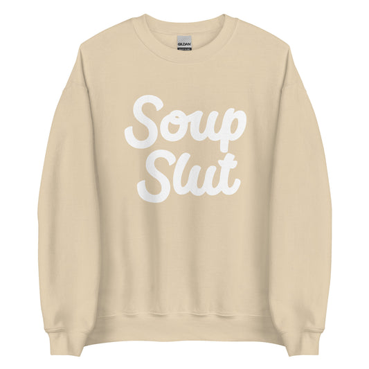 Beige Soup Slut Sweatshirt from Nina's Funky Shop by ninanush - Do you love soup? Looking for a funny gift? Our Soup Slut Crewneck Sweatshirt is soft, comfortable and just what you need. It's a unisex foodie sweatshirt with "soup slut" on the front. A funny foodie sweatshirt for cozy nights in or stand out soup lover streetwear. This soup enthusiast sweatshirt is made just for you.