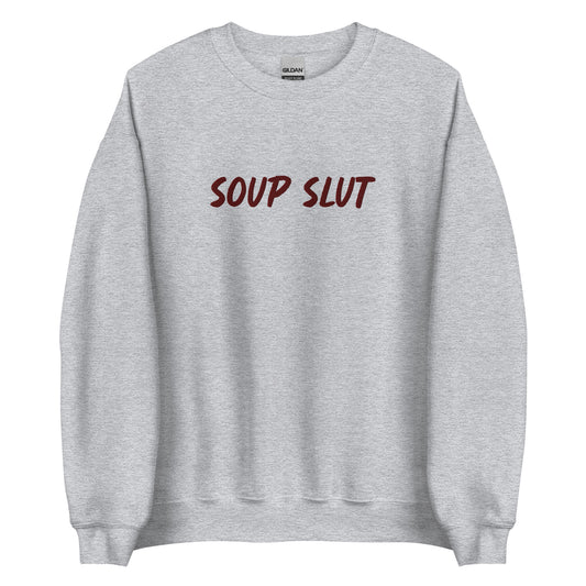 Light Gray Embroidered Soup Slut Sweatshirt from Nina's Funky Shop by ninanush - Do you love soup? Looking for a funny gift? Our Soup Slut Embroidered Crewneck Sweatshirt is just what you need. It's a unisex soup sweatshirt with "soup slut" on the front. A funny foodie sweatshirt for cozy nights in or stand out streetwear for soup enthusiasts. This embroidered soup sweatshirt is made just for you. 