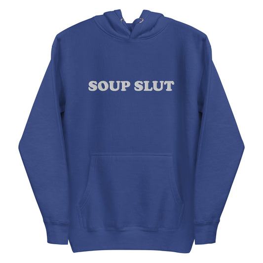 Blue Soup Slut Hoodie - It's always soup season! This Soup Slut Hoodie is soft, comfortable and just what you need. It's a unisex hoodie that comes in a variety of colors with "Soup Slut", expertly embroidered on the front. It's the perfect hoodie for soup season, designed by Nina and made just for you. Celebrate your favorite foods in our funky foodie clothing and accessories!