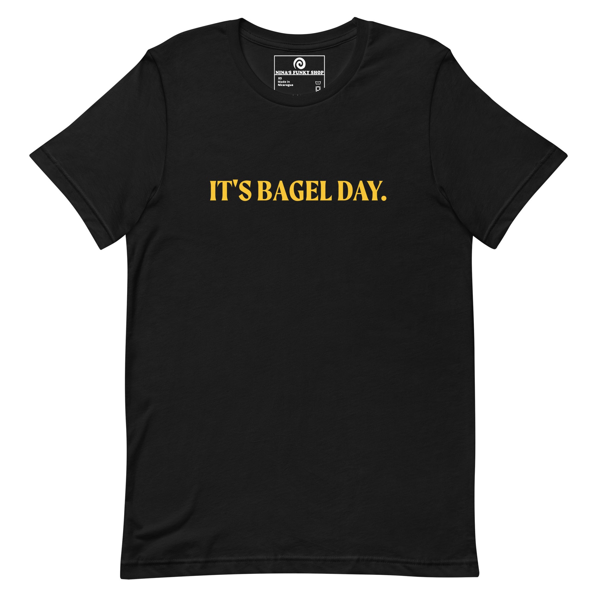 Black It's Bagel Day T-Shirt - Are you a bagel enthusiast? Looking for a funny gift for a fellow bagel lover? Every day is bagel day in our "It's Bagel Day T-shirt". It's a soft and comfortable, unisex t-shirt that comes in a variety of colors with a funny bagel saying, expertly printed on the front. Eat your favorite bagels and make a statement. Celebrate your favorite foods in our funky foodie apparel.