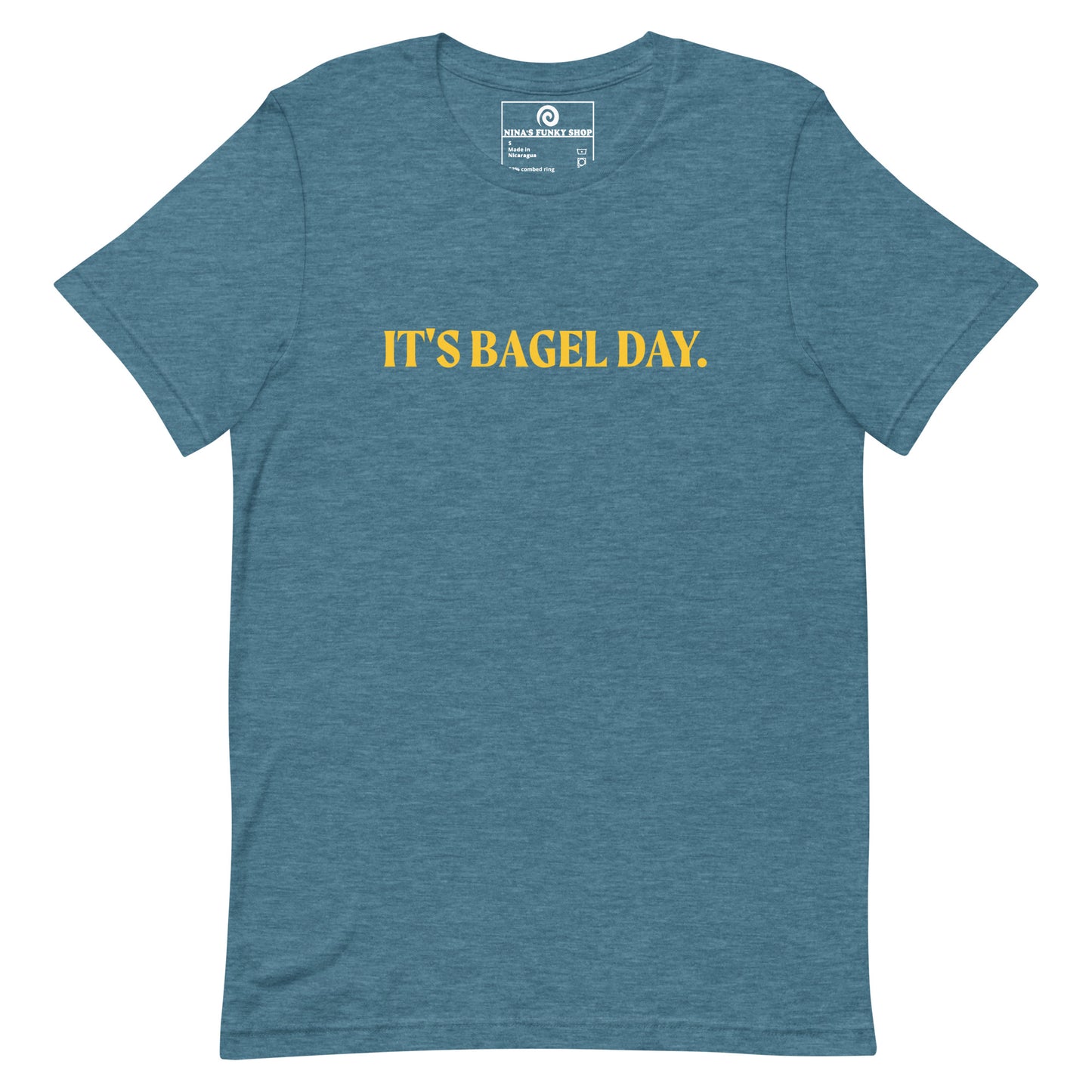 Teal It's Bagel Day T-Shirt - Are you a bagel enthusiast? Looking for a funny gift for a fellow bagel lover? Every day is bagel day in our "It's Bagel Day T-shirt". It's a soft and comfortable, unisex t-shirt that comes in a variety of colors with a funny bagel saying, expertly printed on the front. Eat your favorite bagels and make a statement. Celebrate your favorite foods in our funky foodie apparel.