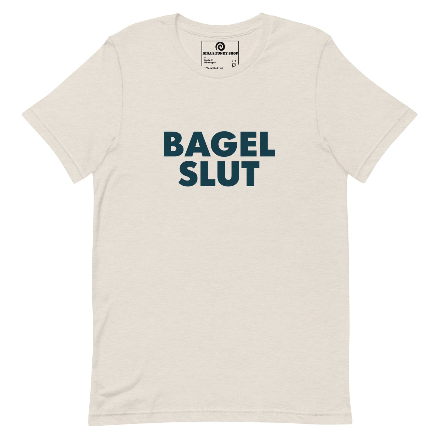 Dust Bagel Slut T-Shirt - Our Bagel Slut T-shirt is soft, comfortable and just what you need. It's a unisex t-shirt that comes in a variety of colors with a funny foodie design, expertly printed on the front. Stand out in our sarcastic t-shirts and celebrate your favorite foods in our funky foodie apparel. Designed by Nina and made just for you! Looking for something personalized? Shoot us an email!