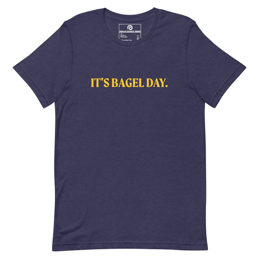 Navy It's Bagel Day T-Shirt - Are you a bagel enthusiast? Looking for a funny gift for a fellow bagel lover? Every day is bagel day in our "It's Bagel Day T-shirt". It's a soft and comfortable, unisex t-shirt that comes in a variety of colors with a funny bagel saying, expertly printed on the front. Eat your favorite bagels and make a statement. Celebrate your favorite foods in our funky foodie apparel.