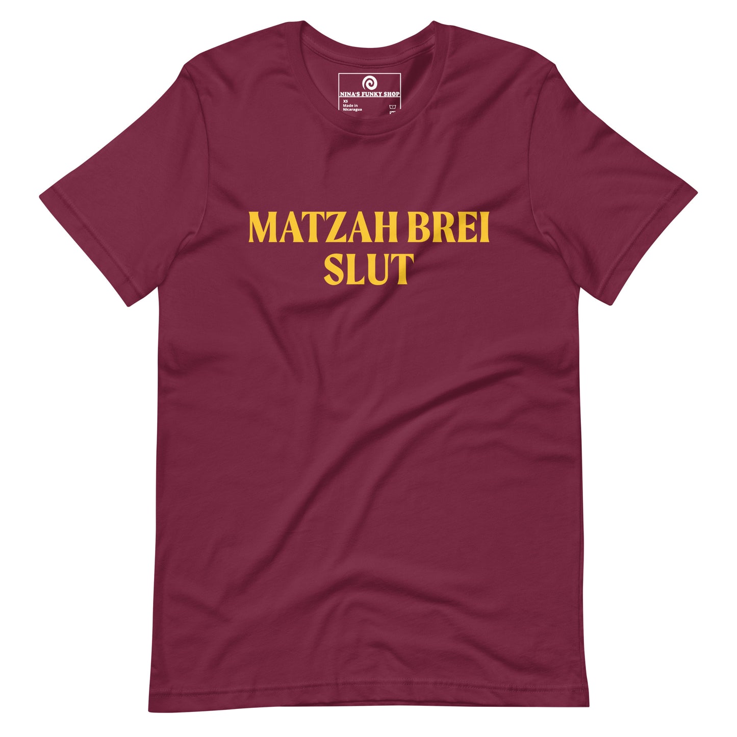 Maroon Matzah Brei Slut - Love matzah brei? Looking for a funny Passover gift? Our Matzah Brei T-shirt is soft, comfortable and just what you need. It's a comfortable, unisex t-shirt that comes in a variety of colors with "Matzah Brei Slut", expertly printed on the front. A funny t-shirt for Passover and for matzah lovers and haters of all kinds.