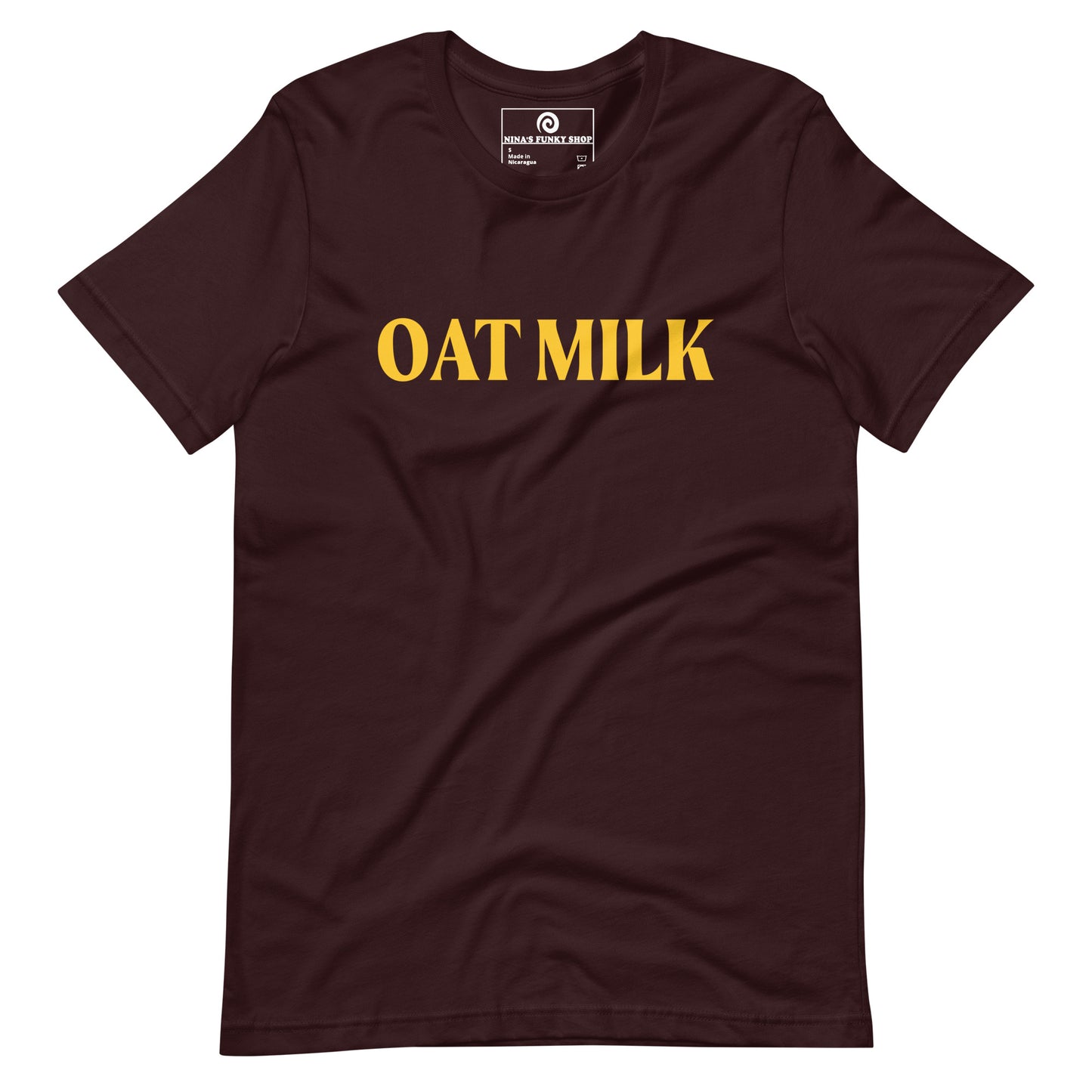 Oxblood Black Oat Milk T-shirt - Are you an oat milk enthusiast? Looking for a funny gift for a dairy free friend? Our Oat Milk T-shirt is soft, comfortable and just what you need. It's a unisex t-shirt that comes in a variety of colors with "oat milk", on the front. A funny t-shirt for plant based babes and foodies of all kinds. Celebrate your favorite foods in our funky foodie apparel. Designed by Nina and made just for you!