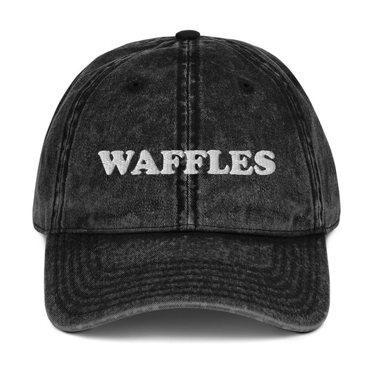 Black vintage style waffles dad hat - The Waffles Dad Hat! This funny food dad hat is the perfect everyday accessory to show off your love of waffles. Wear the unique foodie dad hat for any occasion or give it as a stylish weird gift for a waffle lover. Show off your love of waffles and favorite foods in our vintage style weird dad hats and clothing. 