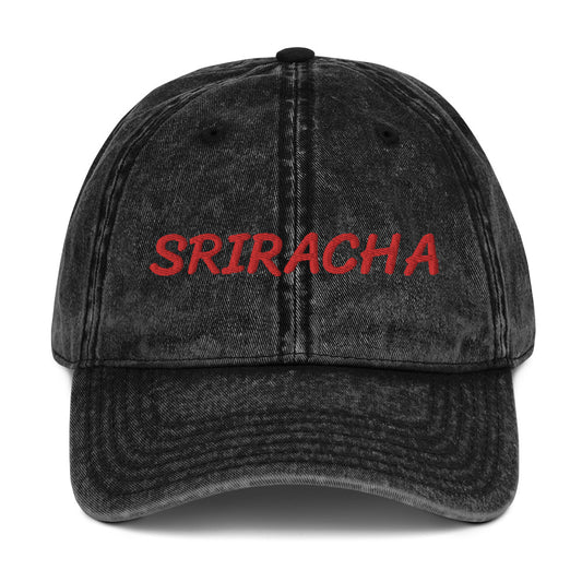 Black sriracha dad hat from Nina's Funky Shop by ninanush - The Sriracha dad hat! Show your love for the beloved hot chili sauce in this funny foodie dad hat. It's comfortable with the word "Sriracha", embroidered on the front. It's a unique accessory that brings personality to your everyday outfits. Stay funky and eat your favorite hot sauce in this sriracha enthusiast hat.