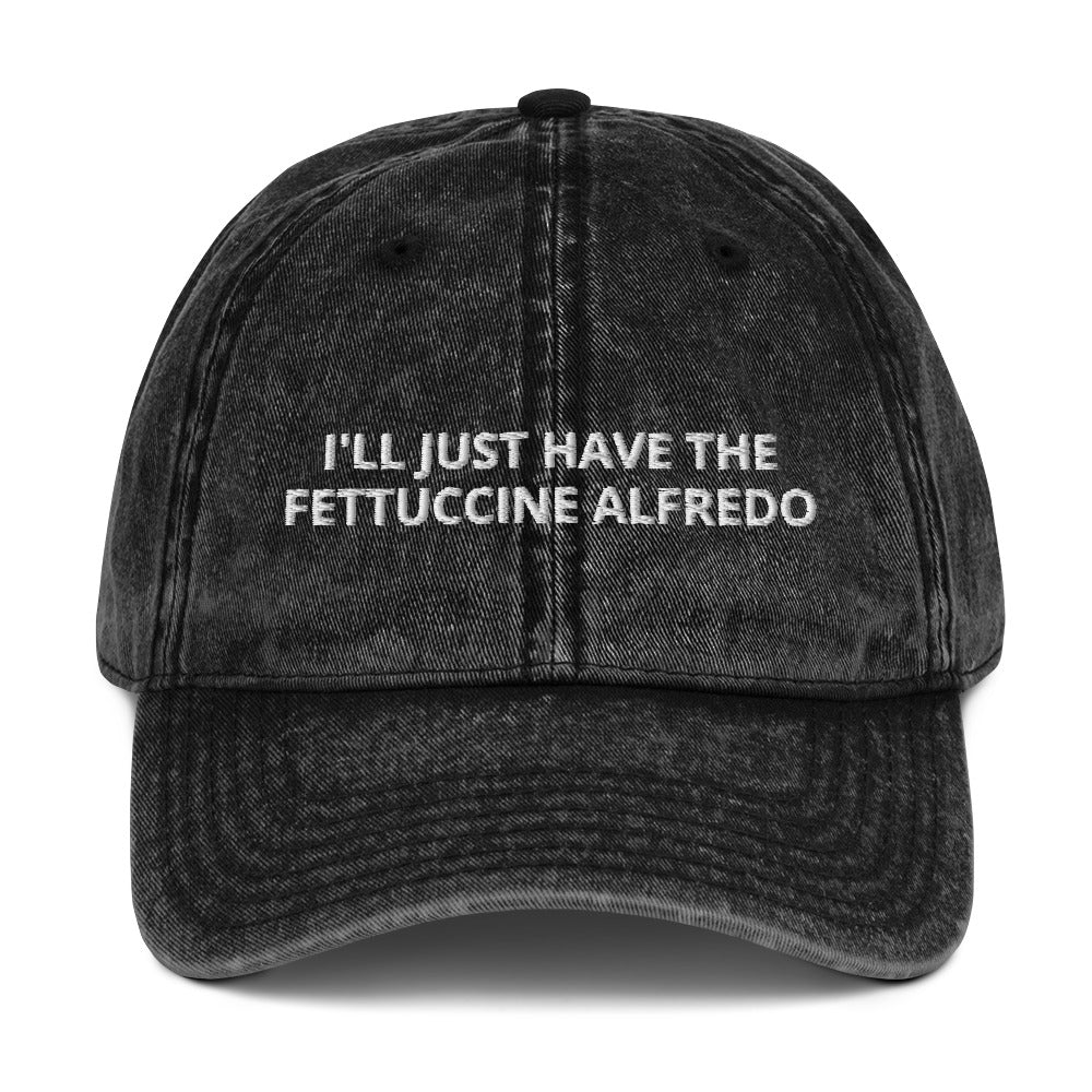 Black I'll Just Have The Fettuccine Alfredo Hat - Love Fettuccine Alfredo? Looking for a funny gift for a pasta lover? Our Fettuccine Alfredo Hat is just what you need. It's comfortable, has an adjustable closure, and comes in a variety of colors with "I'll Just Have The Fettuccine Alfredo", expertly embroidered on the front. Eat your favorite fettuccine in style.