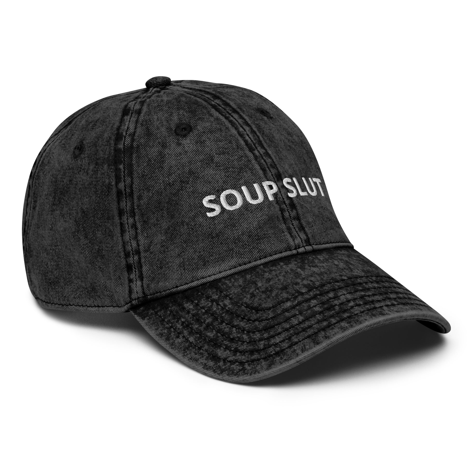 Black soup slut hat - Are you a soup slut? Looking for a funny gift for a soup enthusiast? Our Soup Slut Hat is just what you need. It's comfortable, has an adjustable closure, and comes in a variety of colors with "Soup Slut", expertly embroidered on the front. Eat your favorite soups and add a little personality to your everyday style. Celebrate your favorite foods in our funky foodie clothing and accessories. 