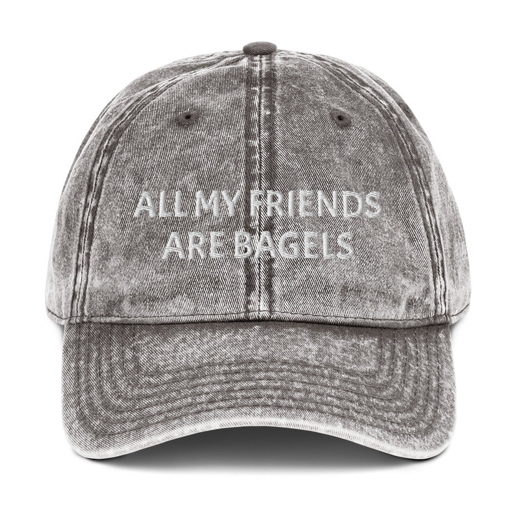 Gray bagel lover hat - The perfect hat for bagel lovers like you. The "ALL MY FRIENDS ARE BAGELS" embroidered dad hat. This funny food hat comes in trendy faded cotton. It's a classic dad hat with a stand out design for bagel enthusiasts. Show your love for bagels with this unique bagel love hat or give it as a funny gift for food lovers.