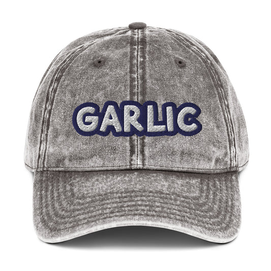 Gray garlic dad hat from Nina's Funky Shop by ninanush - If you're a garlic lover, this funny food hat was designed just for you. Eat garlic in style and make a statement in this stand out foodie dad hat. It's a garlic lover hat that's made of cotton, with a washed out vintage style and an eye-catching blue and white embroidery. Perfect for garlic enthusiasts and foodies of all kinds. 