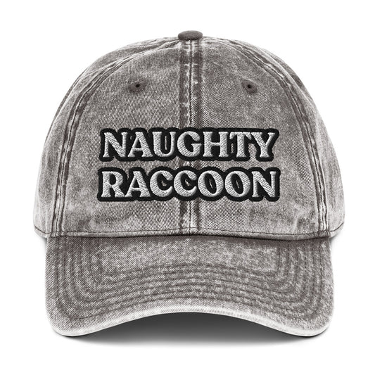 Gray naughty raccoon dad hat from Nina's Funky Shop by ninanush - Stand out in this naughty raccoon hat. It's a vintage style embroidered dad hat with the words "naughty raccoon" in black and white on the front. This unique hat for raccoon enthusiasts is funny and just a little weird. Add a little personality to your everyday style or give it as a funny gift for a raccoon lover. 