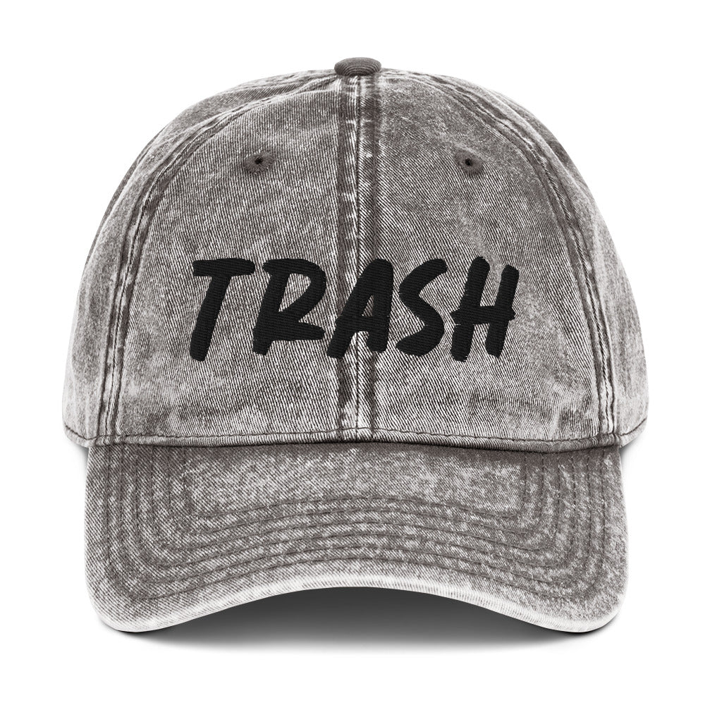 Gray Trash Hat - Live fast, eat trash in this embroidered trash dad hat. It's a classic cotton dad hat with an adjustable closure and "trash", expertly embroidered on the front. Make a statement and live your best life in this funny dad hat. Our trash dad hat with perfect for everyday streetwear or a funny gift for a friend.