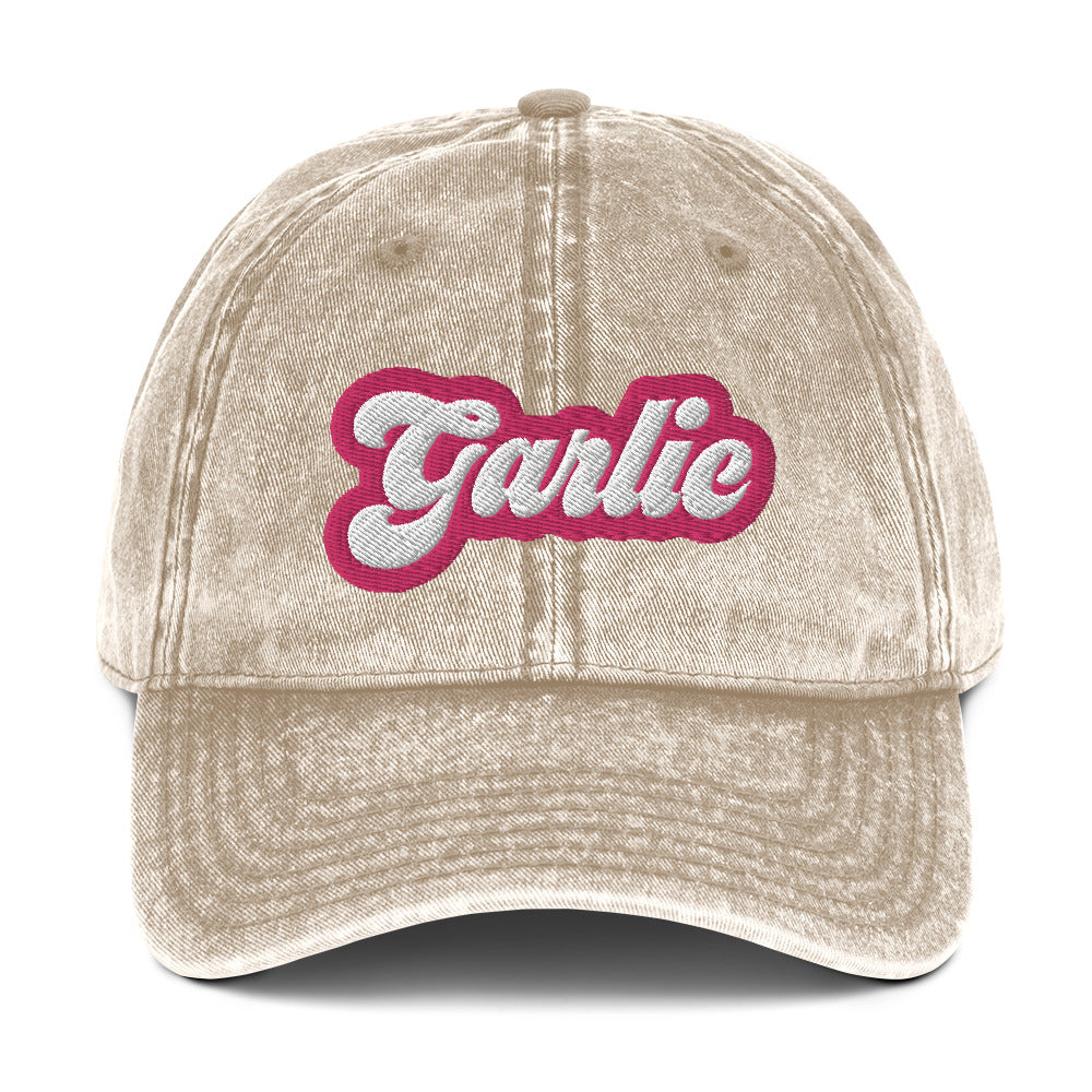 Tan garlic dad hat - A colorful dad hat for garlic enthusiasts and foodies of all kinds. It's a vintage style dad hat with the word "garlic" embroidered in pink and white. A funny statement hat for garlic lovers to stand out and show off or a unique gift for your favorite garlic addict. This quirky dad hat is adjustable, weird and made just for you.