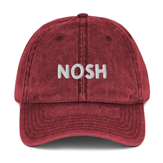 Maroon nosh hat - A nosh hat with a simple text embroidery, vintage-style faded material and it comes in a variety of colors. It's a funny dad hat for foodies or a gift for noshers and food enthusiasts. Nosh on your favorite foods in this yiddish word hat. It's a perfect hat for everyday wear and a unique dad hat for snack lovers.