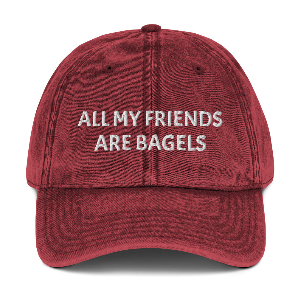 Maroon bagel lover hat - The perfect hat for bagel lovers like you. The "ALL MY FRIENDS ARE BAGELS" embroidered dad hat. This funny food hat comes in trendy faded cotton. It's a classic dad hat with a stand out design for bagel enthusiasts. Show your love for bagels with this unique bagel love hat or give it as a funny gift for food lovers.