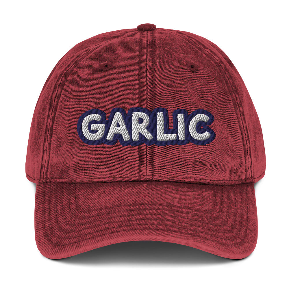 Maroon garlic dad hat from Nina's Funky Shop by ninanush - If you're a garlic lover, this funny food hat was designed just for you. Eat garlic in style and make a statement in this stand out foodie dad hat. It's a garlic lover hat that's made of cotton, with a washed out vintage style and an eye-catching blue and white embroidery. Perfect for garlic enthusiasts and foodies of all kinds.